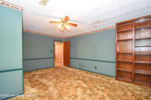 405 4th St, Tallassee, AL 36078 - unfurnished bedroom with carpet flooring and a textured ceiling