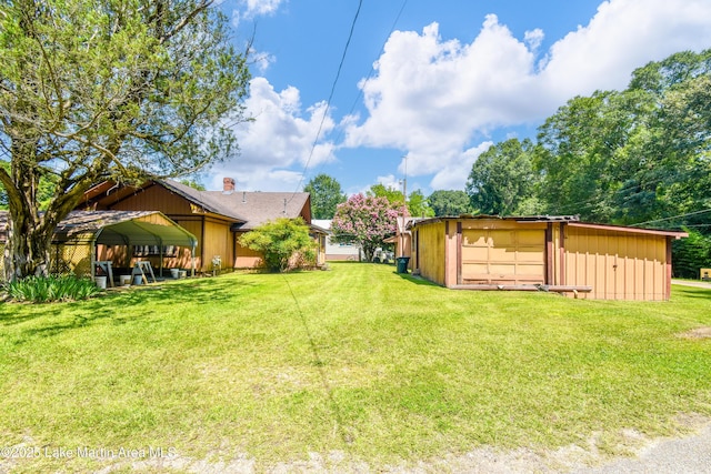 405 4th St, Tallassee, AL 36078 - view of grassy yard with an outbuilding