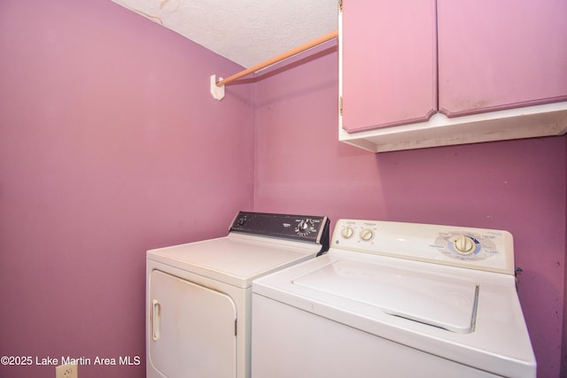 405 4th St, Tallassee, AL 36078 - washroom featuring cabinet space, washing machine and clothes dryer, and a textured ceiling