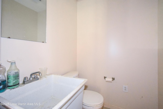 405 4th St, Tallassee, AL 36078 - half bath featuring toilet and vanity