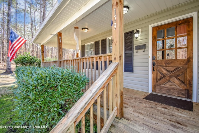 view of exterior entry with a porch