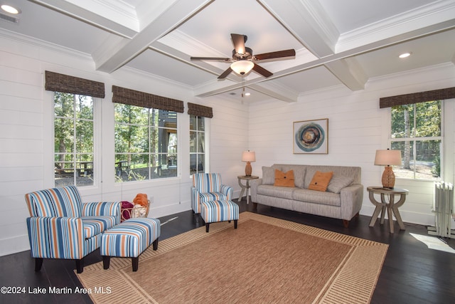 living room featuring beam ceiling, a healthy amount of sunlight, dark wood-type flooring, and coffered ceiling