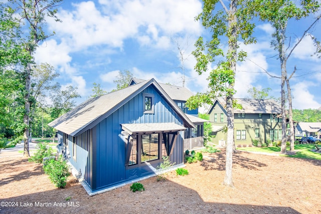 250 Old Jay Rd, Eclectic, AL 36024 - back of house with board and batten siding and a shingled roof