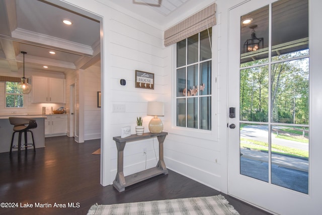 250 Old Jay Rd, Eclectic, AL 36024 - doorway to outside with ornamental molding, dark wood-type flooring, beamed ceiling, and wooden walls