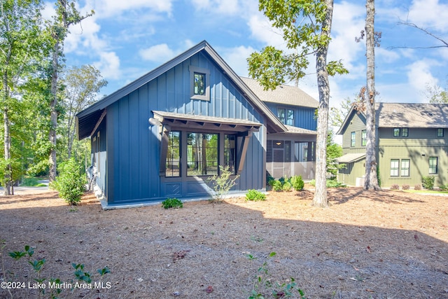 250 Old Jay Rd, Eclectic, AL 36024 - view of front of home featuring board and batten siding and a sunroom