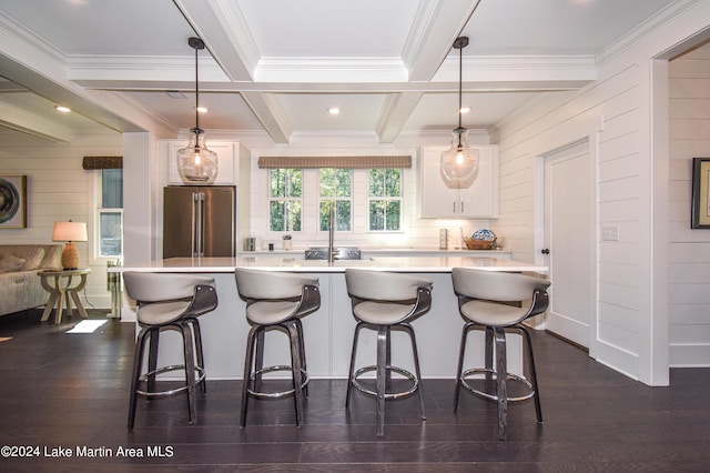 250 Old Jay Rd, Eclectic, AL 36024 - kitchen featuring freestanding refrigerator, white cabinetry, light countertops, a breakfast bar area, and beam ceiling