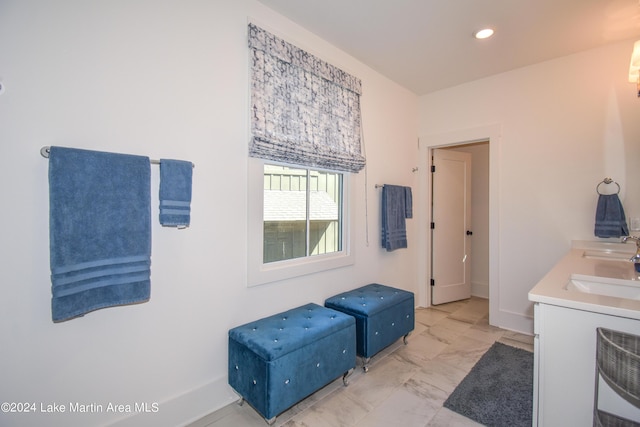 250 Old Jay Rd, Eclectic, AL 36024 - bathroom featuring marble look tile flooring, recessed lighting, and double vanity