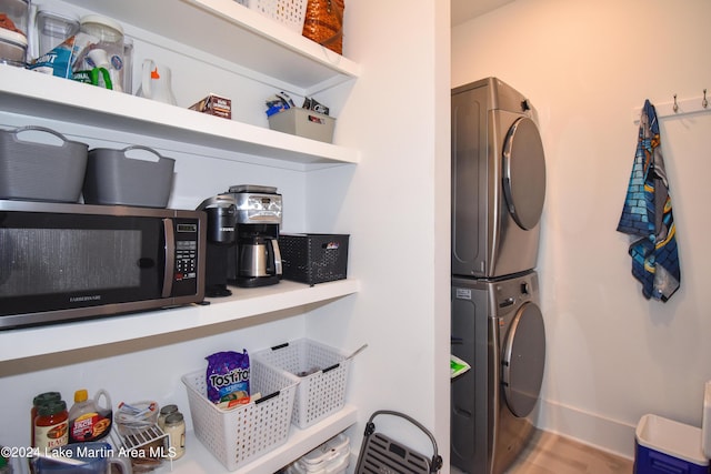 laundry area with stacked washer / drying machine