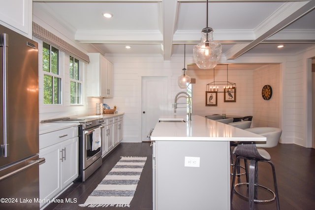 250 Old Jay Rd, Eclectic, AL 36024 - kitchen with appliances with stainless steel finishes, dark wood-style flooring, a breakfast bar, beam ceiling, and white cabinetry