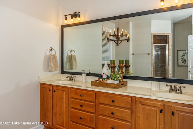 full bathroom with a sink, double vanity, and a shower stall