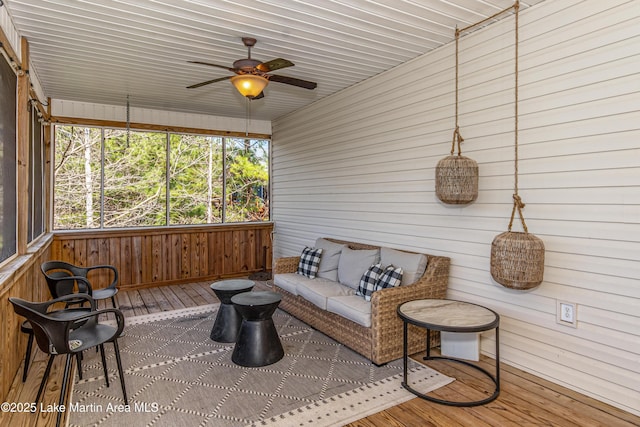 sunroom / solarium with ceiling fan