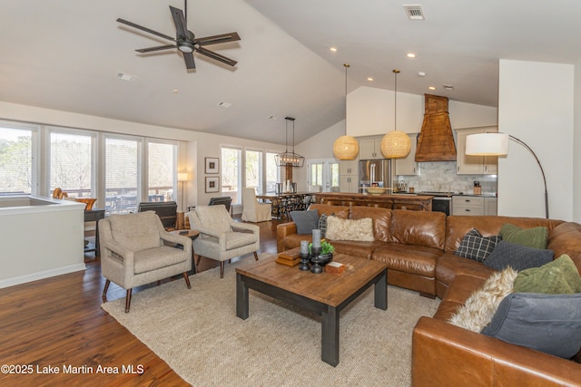 living room featuring recessed lighting, visible vents, high vaulted ceiling, and dark wood-style flooring