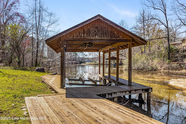 view of dock featuring boat lift and a water view