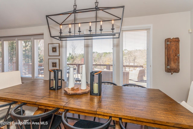 dining area featuring a chandelier