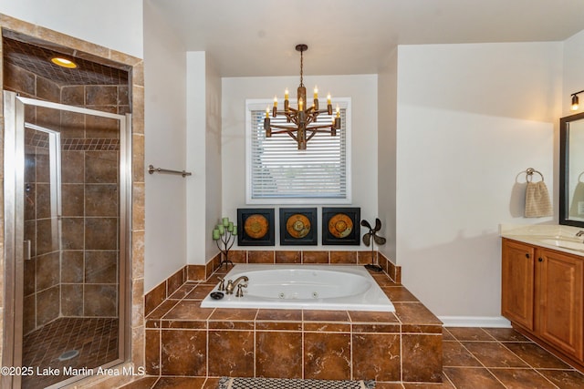 full bathroom with vanity, tile patterned flooring, a shower stall, a jetted tub, and a notable chandelier