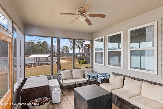 sunroom / solarium with ceiling fan