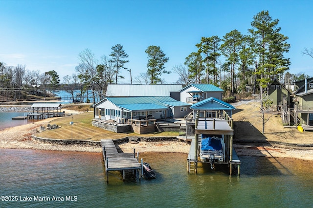 dock area with boat lift and a water view