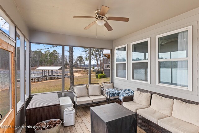 sunroom featuring ceiling fan