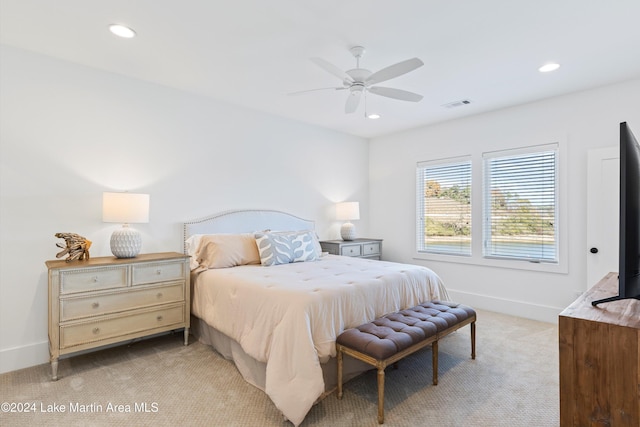 bedroom featuring ceiling fan and light colored carpet