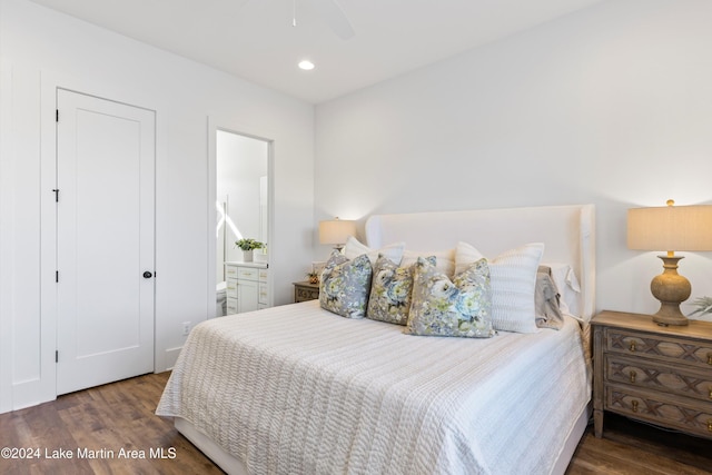 bedroom featuring ceiling fan, dark wood-type flooring, and connected bathroom