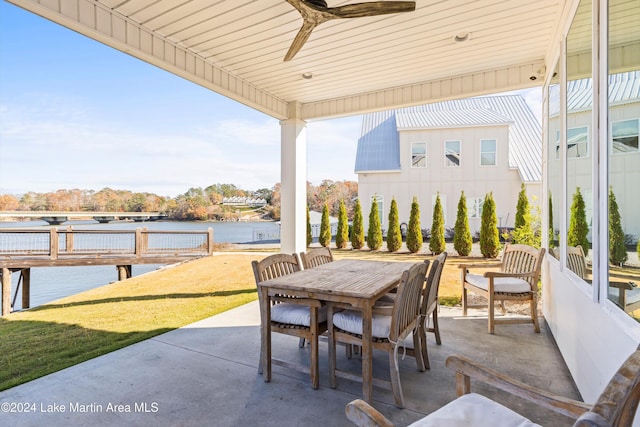 view of patio / terrace with a water view and ceiling fan