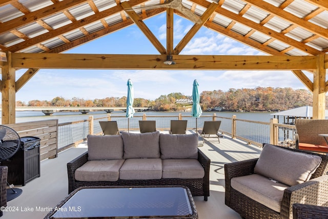 view of patio featuring a gazebo, a water view, and an outdoor hangout area