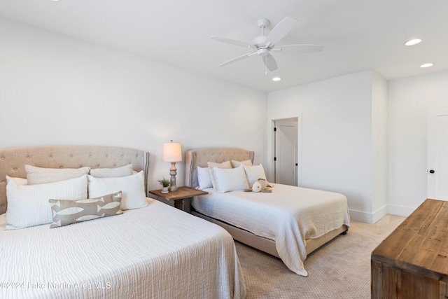 carpeted bedroom featuring ceiling fan