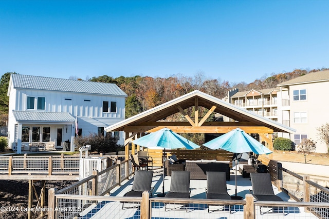 rear view of house with an outdoor hangout area and a deck