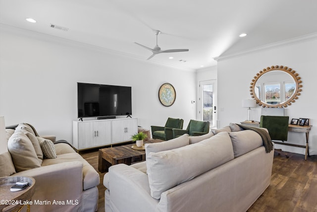 living room featuring crown molding, ceiling fan, and dark wood-type flooring