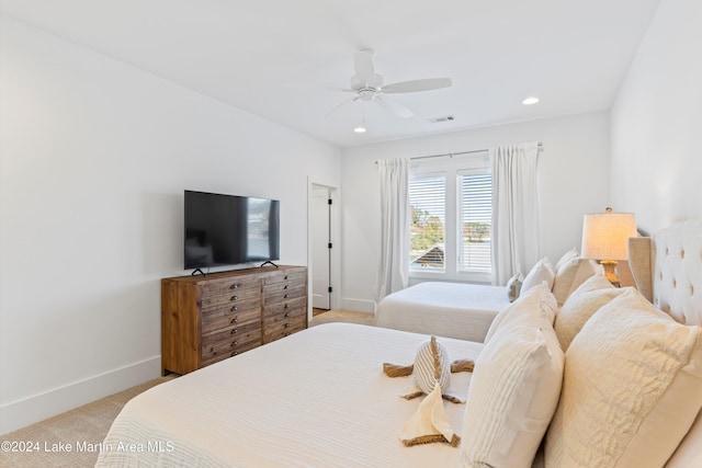 carpeted bedroom with ceiling fan