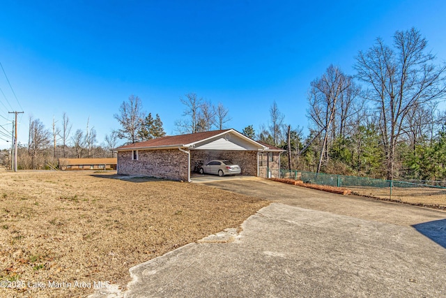 exterior space featuring a yard and a carport