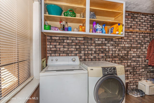 clothes washing area featuring washing machine and dryer