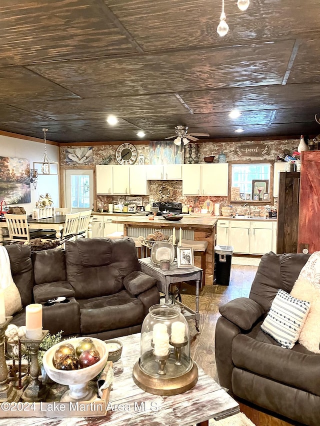 living room featuring light wood-type flooring, ceiling fan, a healthy amount of sunlight, and wood ceiling