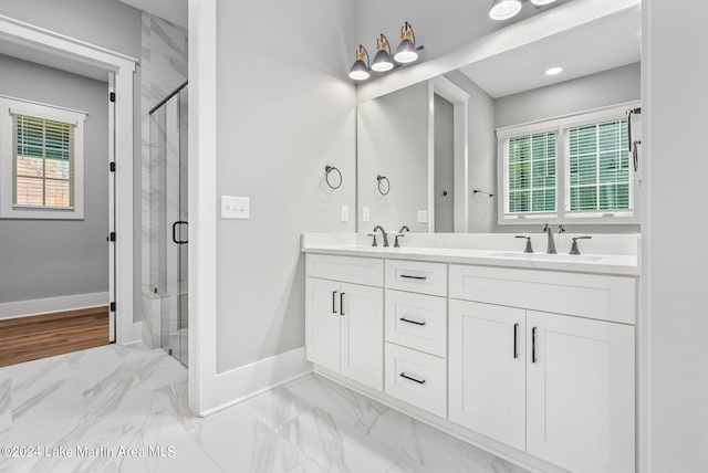 bathroom with vanity and an enclosed shower