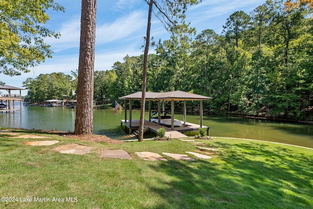 dock area featuring a yard and a water view