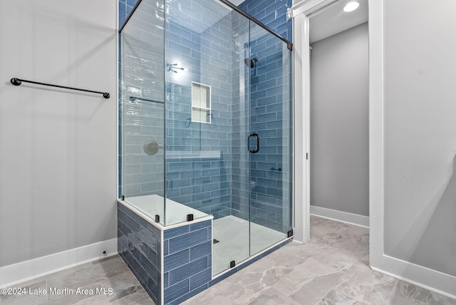 bathroom featuring an enclosed shower