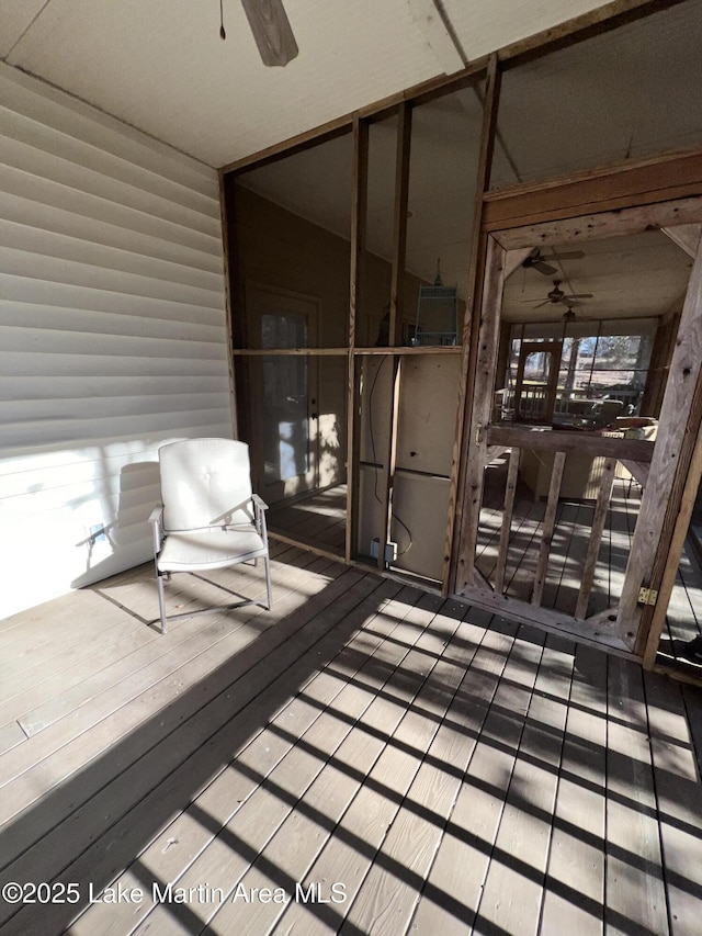 wooden deck featuring ceiling fan