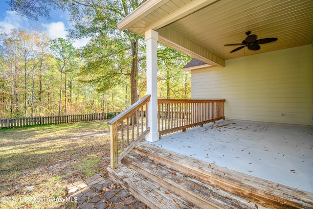 wooden terrace featuring ceiling fan