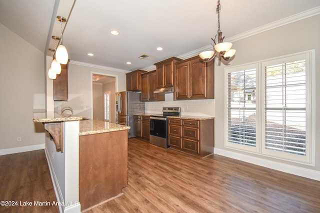 kitchen with a kitchen breakfast bar, dark hardwood / wood-style floors, decorative backsplash, appliances with stainless steel finishes, and kitchen peninsula