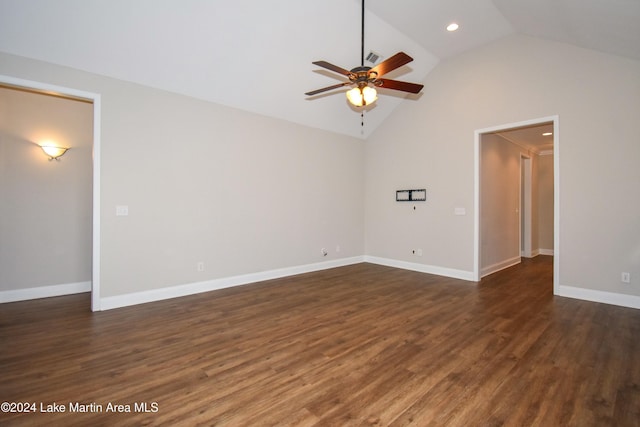 unfurnished room with dark hardwood / wood-style floors, vaulted ceiling, and ceiling fan