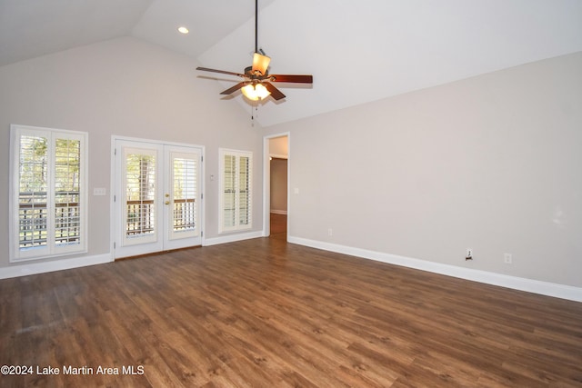 unfurnished living room with french doors, high vaulted ceiling, ceiling fan, and dark wood-type flooring