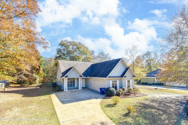 view of front of home featuring a garage and a front lawn