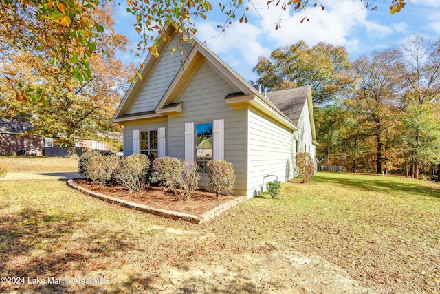 view of home's exterior featuring a yard