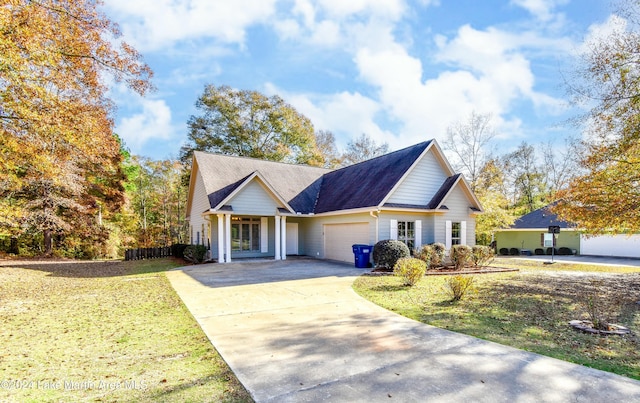 view of property with a front lawn and a garage