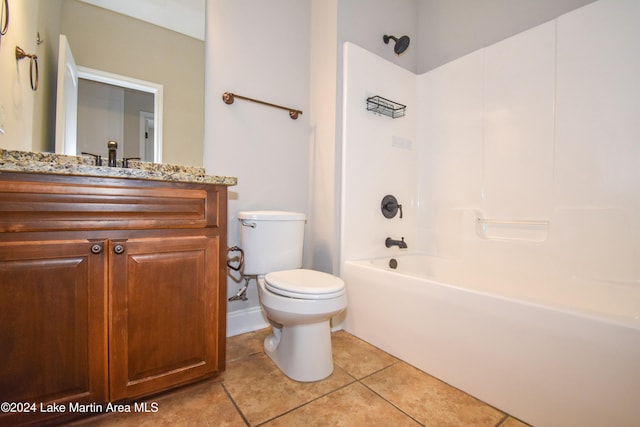 full bathroom with toilet, vanity,  shower combination, and tile patterned floors