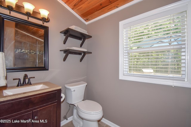 838 Bama Park Rd, Dadeville, AL 36853 - bathroom with toilet, baseboards, vanity, and tiled shower
