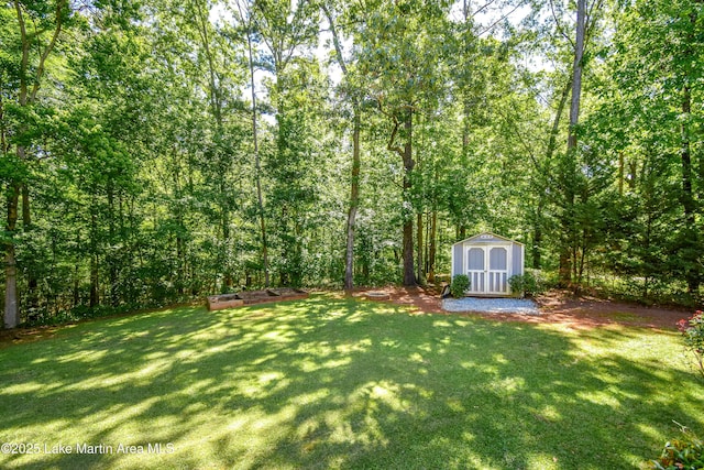 838 Bama Park Rd, Dadeville, AL 36853 - view of green lawn with a storage unit and an outbuilding