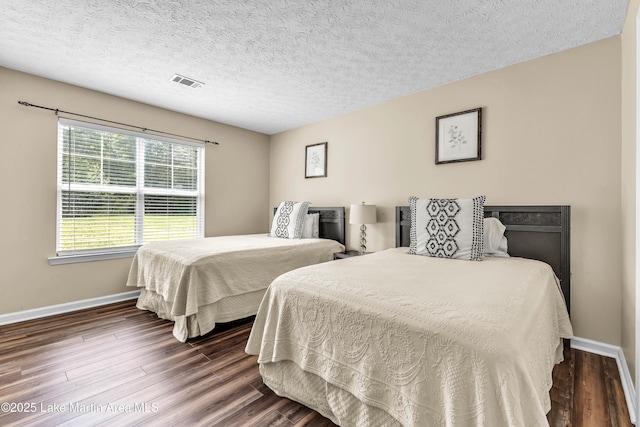 741 Lakeview Rdg, Dadeville, AL 36853 - bedroom with dark wood-style floors and a textured ceiling
