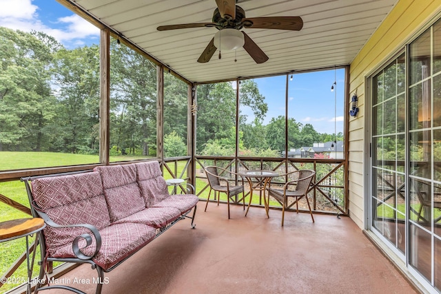 741 Lakeview Rdg, Dadeville, AL 36853 - sunroom / solarium featuring an outdoor hangout area, ceiling fan, and view of scattered trees
