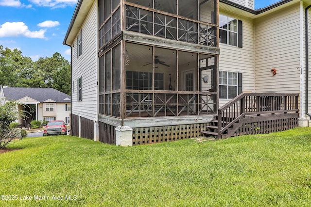 741 Lakeview Rdg, Dadeville, AL 36853 - rear view of house with a lawn, a ceiling fan, and a sunroom